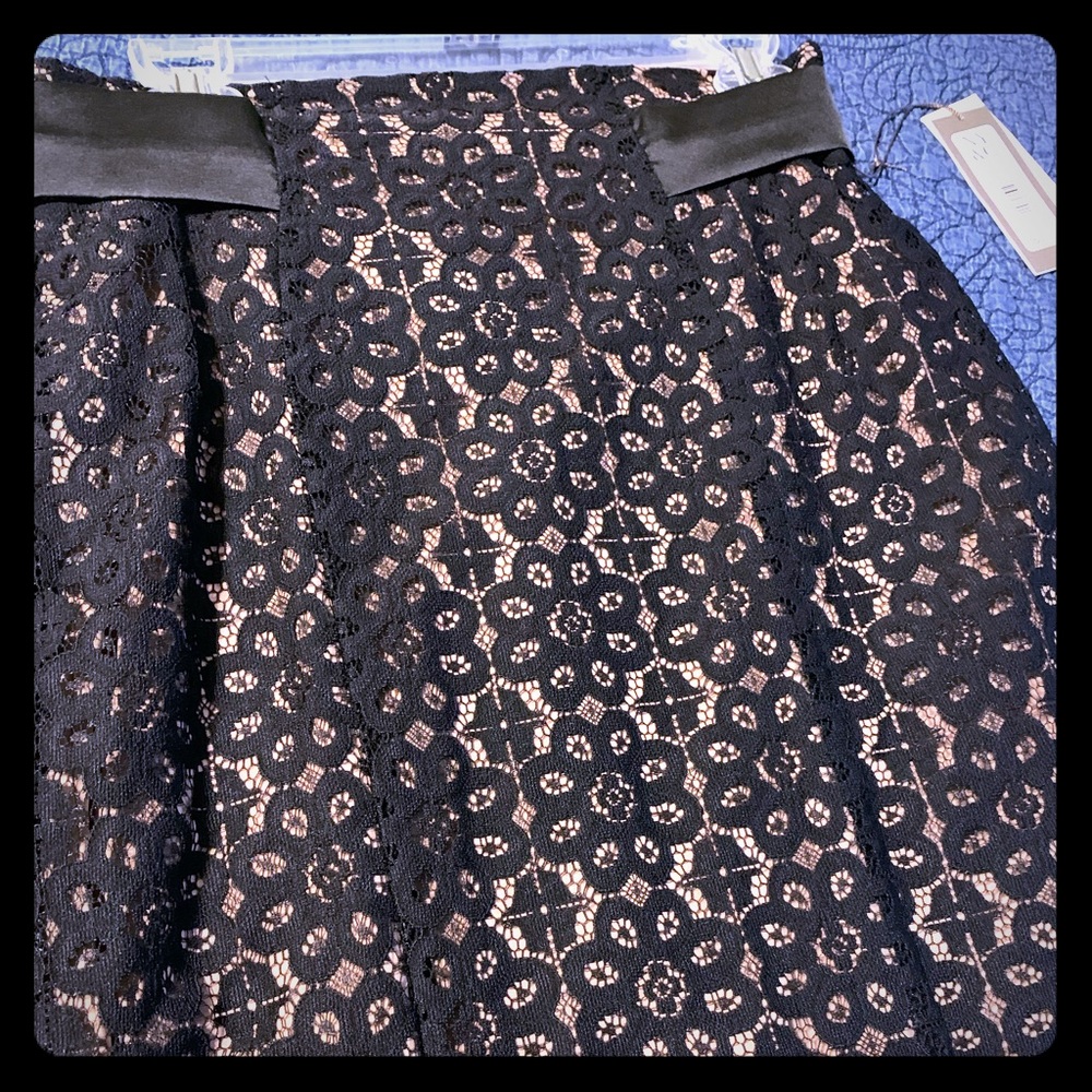 Laced pencil skirt.